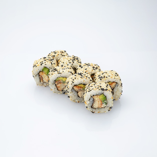 Japanese cuisine. Sushi roll on white background. Top view