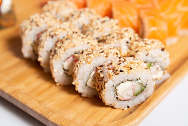 Premium Photo | Japanese cuisine sushi tempura on a wooden plate close up