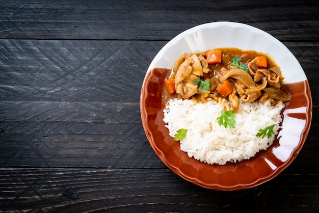 Japanese curry rice with sliced pork, carrot and onions