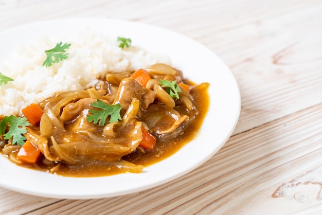 Japanese curry rice with sliced pork, carrot and onions