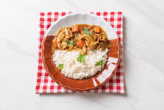 Japanese curry rice with sliced pork, carrot and onions