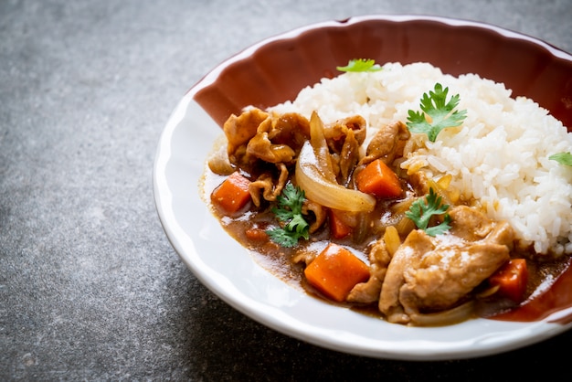 Japanese curry rice with sliced pork, carrot and onions