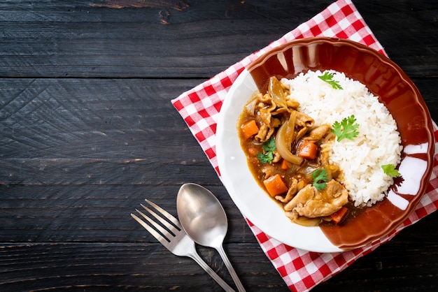 Japanese curry rice with sliced pork, carrot and onions