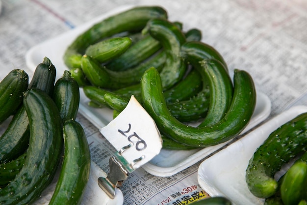 Japanese curved cucumbers at a Kyoto fruit market in Japan