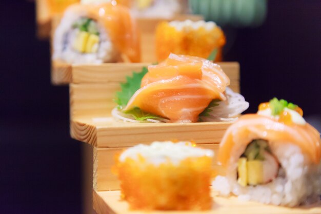 Japanese Fish Food Menu, Salmon Sushi and Sashimi Assortment in traditional Japanese Restaurant