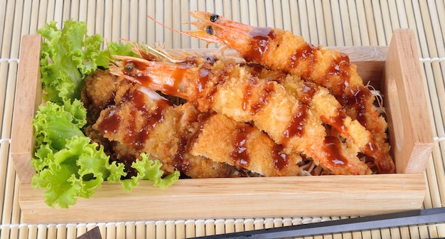 Japanese food - fried tempura shrimps and fried pork.