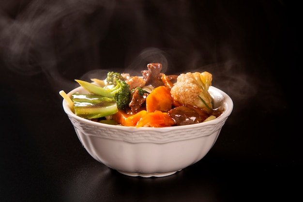 Japanese food. meet and vegetables with smoke. Yakisoba.