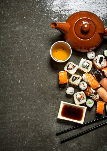 Japanese food The rolls and sushi with soy sauce and herbal tea