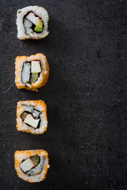 Japanese food sushi on black slate top view