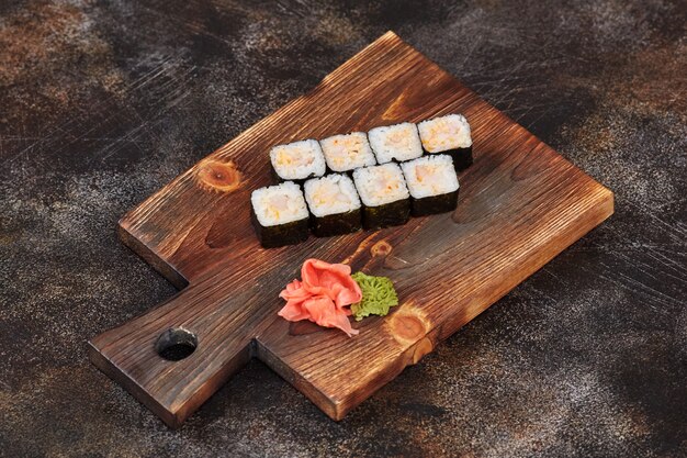 Japanese food sushi maki rolls on wooden board