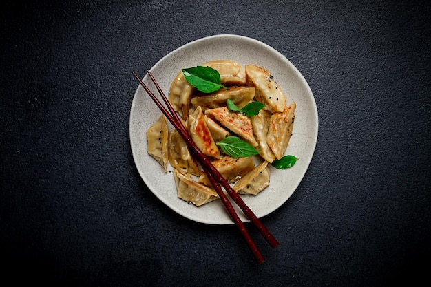 japanese fried dumplings gyoza sesame seeds top view no people