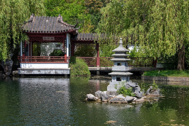 Japanese garden with pagoda and pond in summer