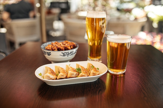 Japanese gedza and katsudon chicken rice with beer