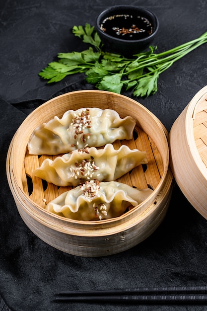 Japanese gyoza in a traditional bamboo steamer