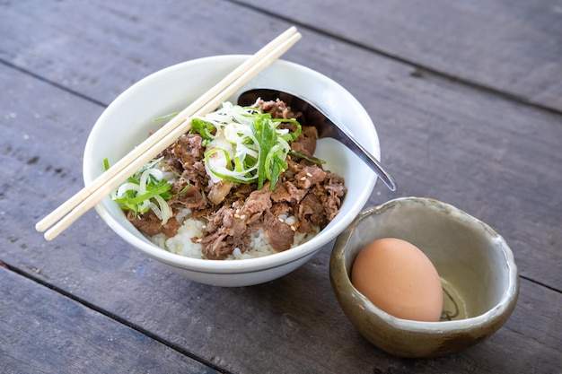 Japanese Gyudon or sliced beef cooked with sauce on rice. Serve with Onsen egg , japanese foods