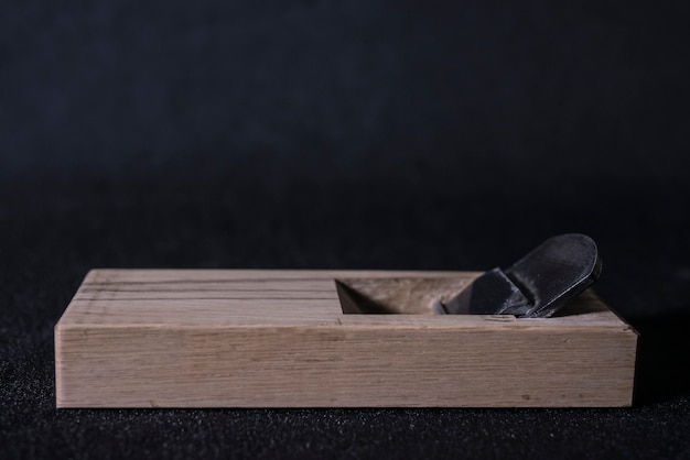 Japanese hand plane on a black background