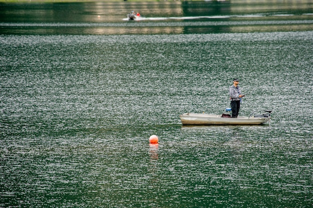 japanese lake near fuji mount with fisher man