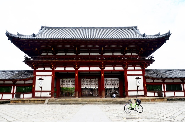 Japanese people and foreigner travellers biking bicycle and visit this measure has been registered as World Heritage Site at Todaiji Temple on July 9 2015 in Nara Japan