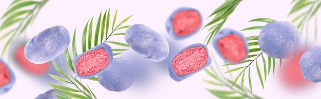 일본 떡이 공중에 떠 있다 분홍색 배경에 날아다니는 떡과 녹색 야자수 잎의 개념적 구성 아시아 요리 아시아 달콤한 길거리 음식 디저트 개념 창의적인 음식