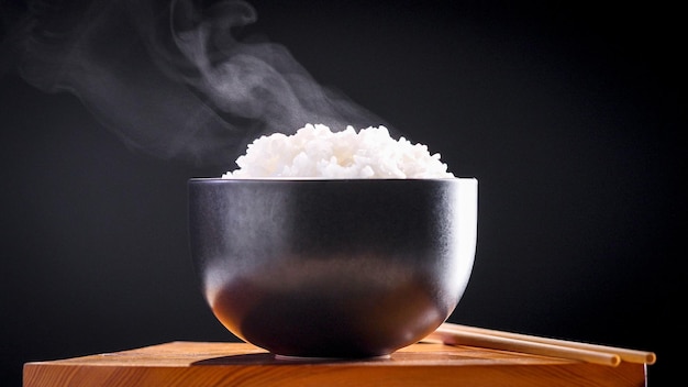 Japanese rice, Cook rice. Close up natural steaming cooked Japanese white rice in black bowl