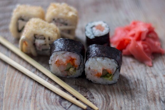 Japanese rolls closeup of avocado and salmon on a wooden background