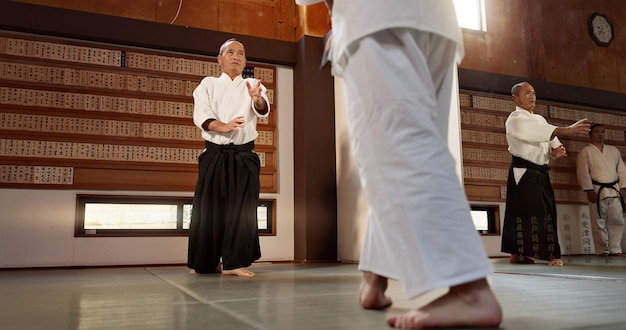 Japanese students aikido or sensei in dojo to start practice lesson discipline or teaching self defense Black belt master people learning combat or athletes in fighting class training or sports