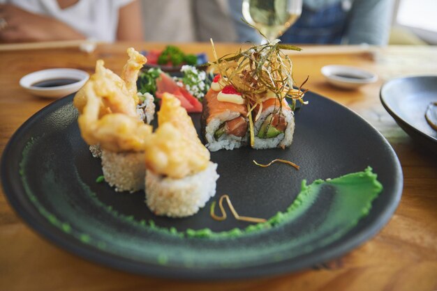 Japanese sushi and food at a restaurant for dinner or lunch meal at a healthy asian cafe on table plate cuisine and fine dining takeaway or seafood from a salmon menu for diet or nutrition