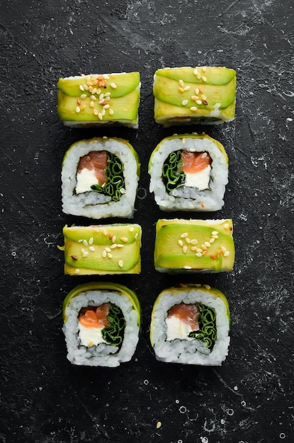 Japanese sushi Green dragon Avocado onion salmon and sushi cheese Top view