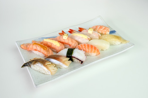 Japanese sushi nigiri of Salmon, Shrimp, Saba, Tako, Squid, Engawa on ceramic plate