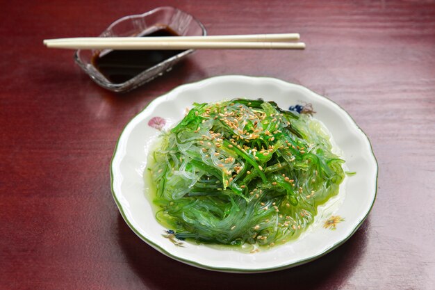 Japanese sushi plate, on wooden table.