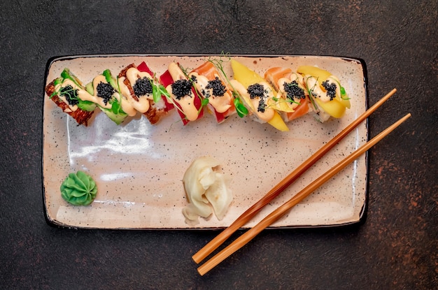 japanese sushi rolls on a stone background