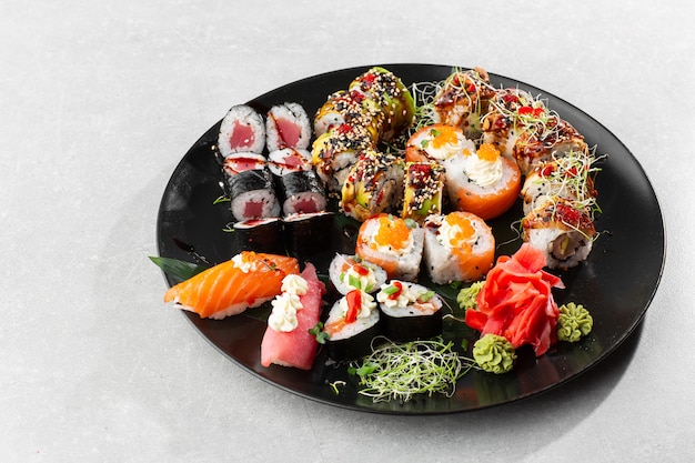 Japanese sushi set. Set of fresh tuna maki , salmon nigiri and dragon sushi rolls