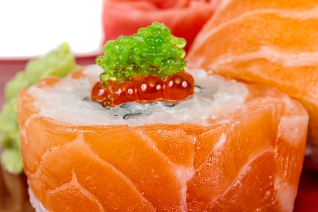 Japanese sushi traditional japanese foodRoll made of salmon red cavair roe and cream