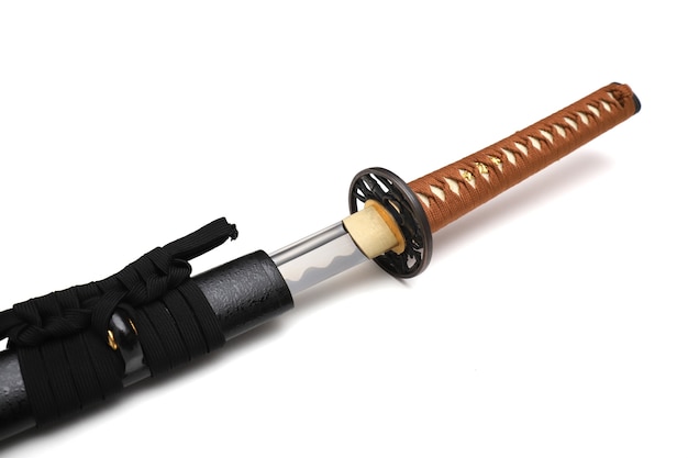 Japanese sword steel fitting and brown cord with black scabbard isolated in white.