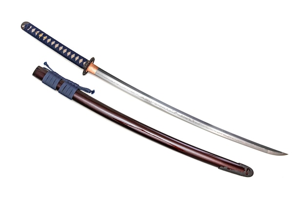 Japanese sword with navy blue cord steel fitting and shiny crimson red scabbard on white background Selective focus