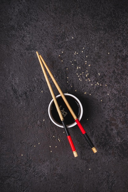 Japanese table setting bamboo chopsticks and mat in red black colors