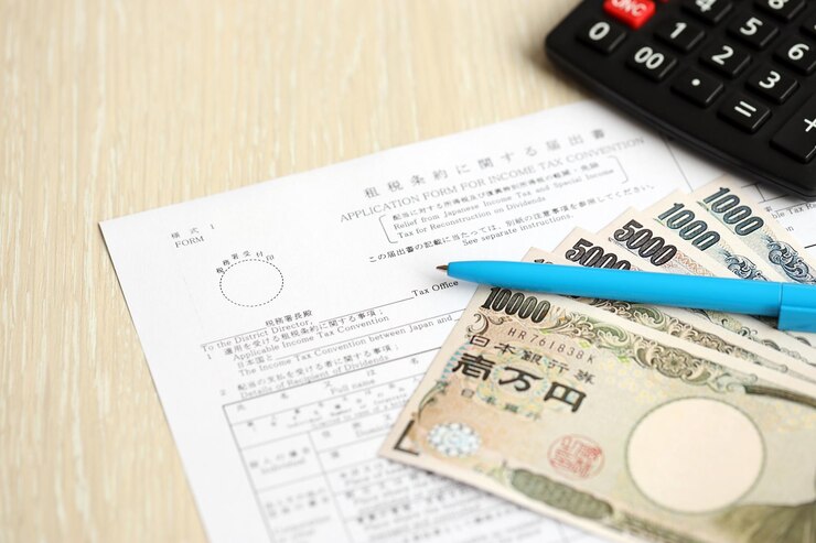 Photo 日本の所得税と特別税の免除 配当の再建のための日本の税制形式