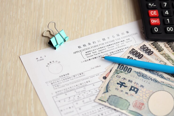 Photo 日本の所得税とロイヤルティの再建のための特別税からの日本の税制の免除