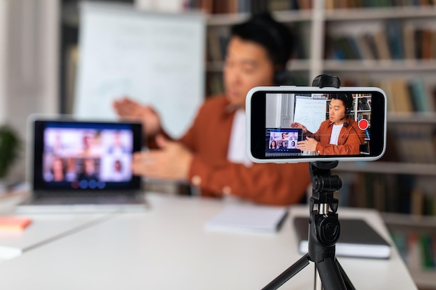 Japanese teacher video calling via cellphone teaching online in\
classroom