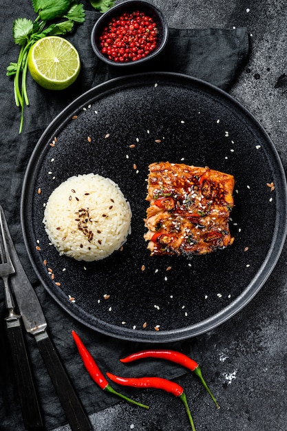 Japanese Teriyaki grilled sea trout fillet  with a side dish of rice. Top view