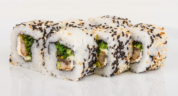 Japanese traditional Cuisine Maki Roll with Nori Cream Cheese and Eel Isolated over white background Isolated over white background