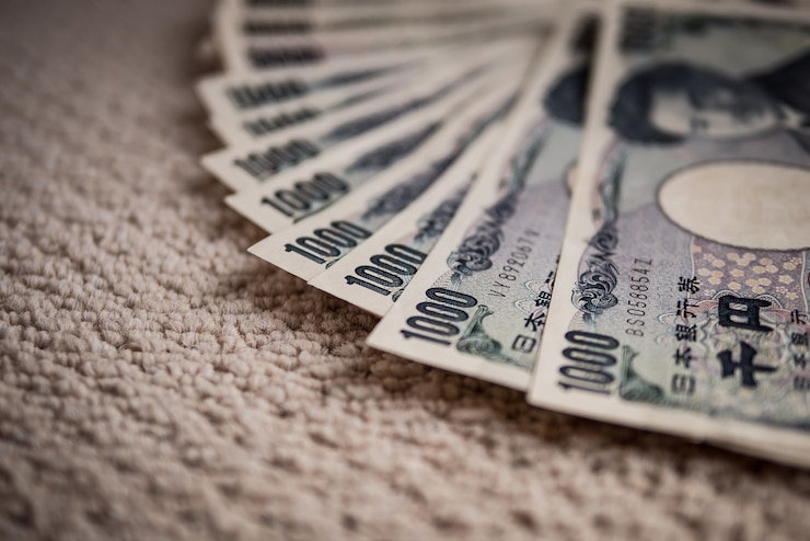Photo 日本円紙幣は、ショットとスタックのレイヤーを閉じます。日本の通貨。