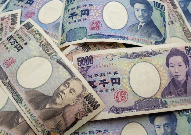 Японская иена отмечает и японские иены монеты для денег концепции фон