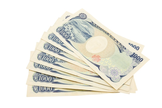 日本円ノート。白い背景の日本の通貨