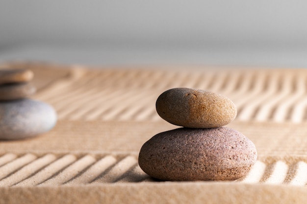 Japanese zen garden with stone in raked sand