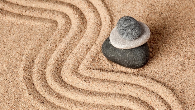 Japanese Zen stone garden relaxation meditation balance concept pebbles and raked sand calm scene