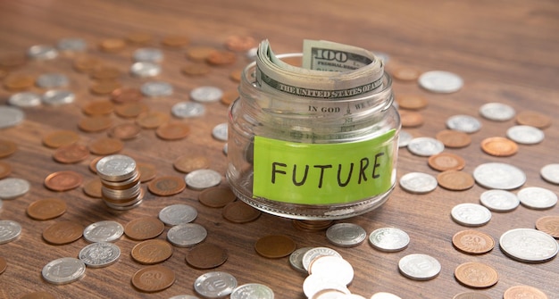 Jar of coins and word Future Concept of saving money for future