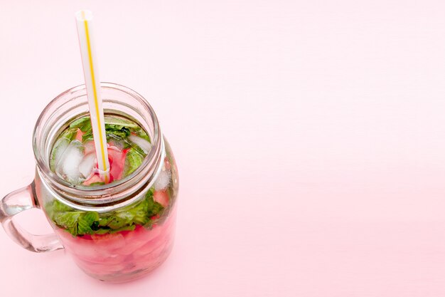 Jar of cold fresh lemonade with watermelon