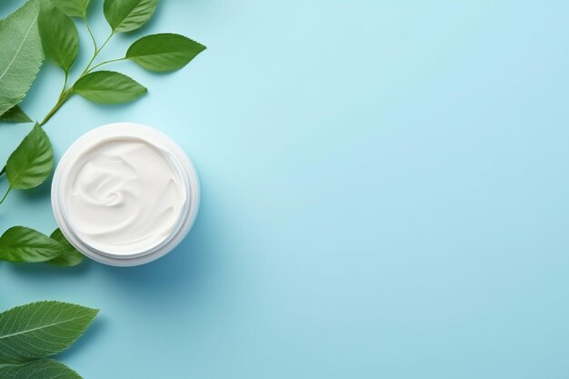Jar of cream and green leaves on color background top view cosmetic products