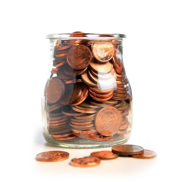 A jar of euro cents over white background